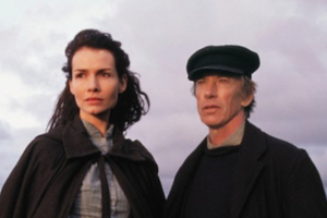 Man and woman standing together by the coast in Connemara in a scene from The Seventh Stream